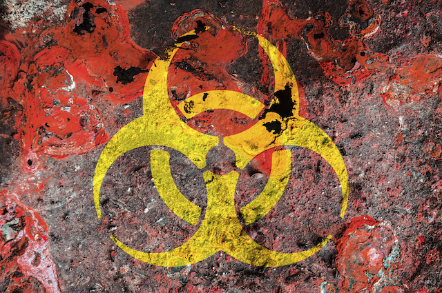 Biohazard symbol on a rust metal plate